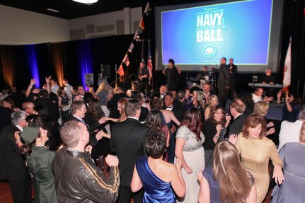 151017-N-HW977-748 RIVERSIDE, Calif. (Oct. 17, 2015) Guests jam the dance floor as TMK Allstarz perform during the inaugural Inland Empire Navy Birthday Ball. The sold-out event, to commemorate the Navy's 240th birthday, included dinner, ceremonies, music, dancing and a keynote address by U.S. Representative Ken Calvert (R-Corona). All proceeds will benefit the Navy-Marine Corps Relief Society. (U.S. Navy photo by Greg Vojtko/Released)