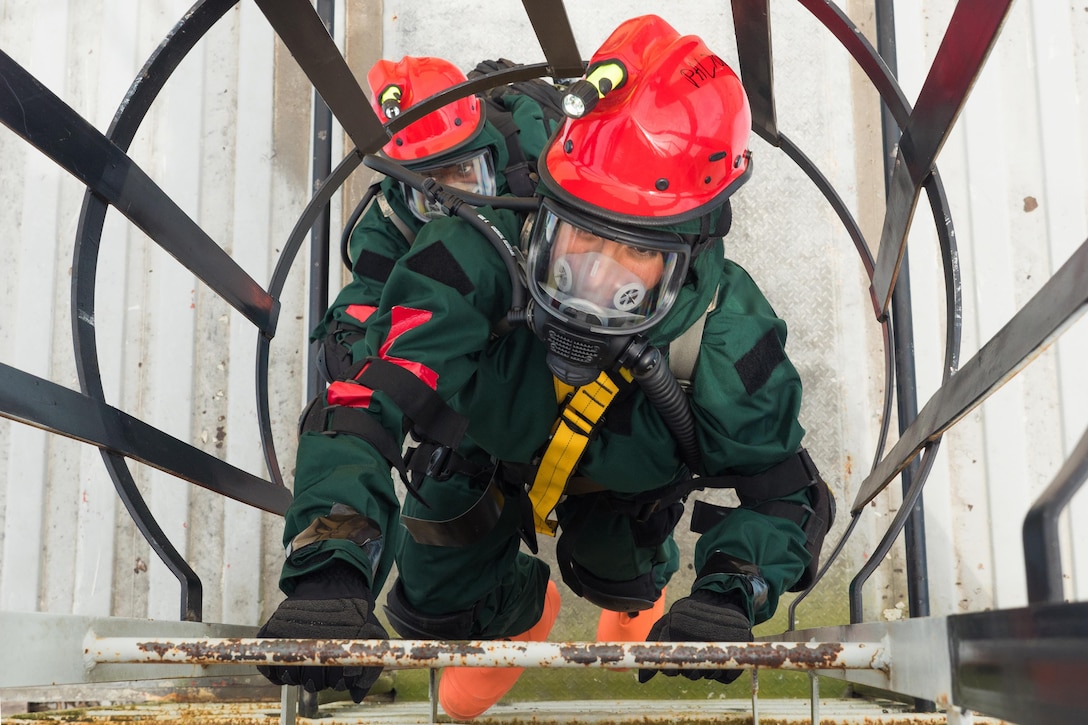 Air Force Staff Sgt. Ivon Palacios-Araujo climbs a ladder to access a tower holding a simulated patient during a pre-external evaluation exercise at Pelham Range, Ala., April 19, 2016. Palacios-Araujo is a search and extraction medic with the Georgia Air National Guard’s Detachment 1, 116th Medical Group. Georgia National Guard photo by Air Force Senior Master Sgt. Roger Parsons