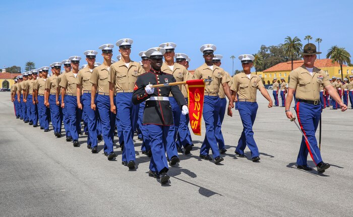 Marines from Mike Company, 3rd Recruit Training Battalion, march across the parade deck during a graduation ceremony at Marine Corps Recruit Depot San Diego, April 15. Graduation takes place at the completion of a 13-week transformation including training in drill, marksmanship, basic combat skills and Marine Corps customs and traditions. Annually, more than 17,000 males recruited from the Western Recruiting Region are trained at MCRD San Diego.