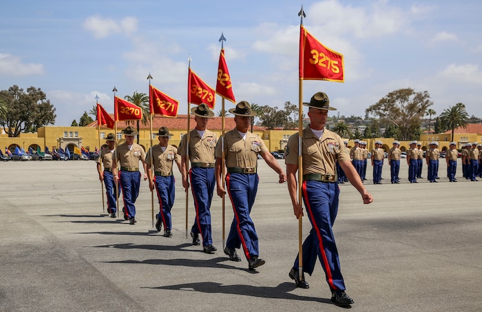 Drill instructors from Mike Company, 3rd Recruit Training Battalion, march in formation after receiving the guidons from the company honormen during the graduation ceremony at Marine Corps Recruit Depot San Diego, April 15. Graduation takes place at the completion of a 13-week transformation including training in drill, marksmanship, basic combat skills and Marine Corps customs and traditions. Annually, more than 17,000 males recruited from the Western Recruiting Region are trained at MCRD San Diego.