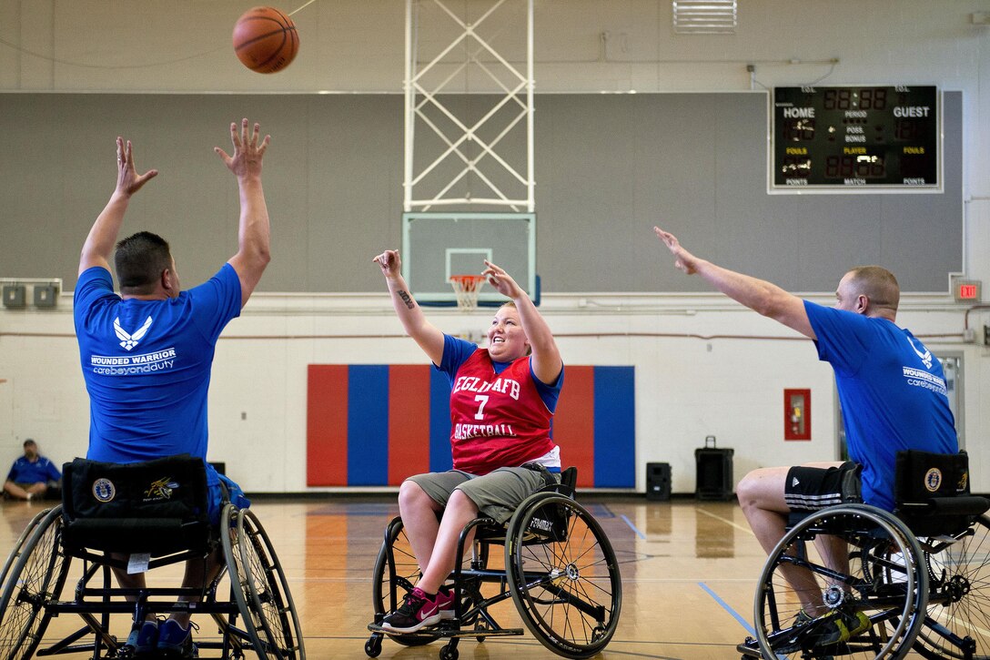 Lindie Kobel, a Warrior Games athlete, takes a shot at the basket during a wheelchair basketball session at the adaptive sports camp at Eglin Air Force Base, Fla., April 5, 2016. The base hosted a weeklong Warrior Games training camp before the yearly competition in June. Air Force photo by Samuel King Jr.