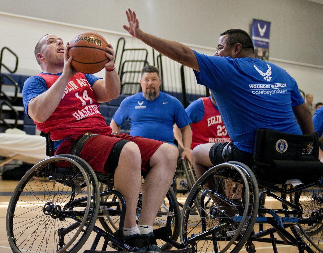 A Warrior Games athlete takes a shot during a wheelchair basketball session at the adaptive sports camp at Eglin Air Force Base, Fla., April 5, 2016. Air Force photo by Samuel King Jr.