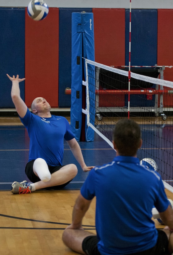 Austin Williamson, a Warrior Games athlete, reaches up to spike the ball during a morning sitting volleyball session at the adaptive sports camp at Eglin Air Force Base, Fla., April 5, 2016. Air Force photo by Samuel King Jr.