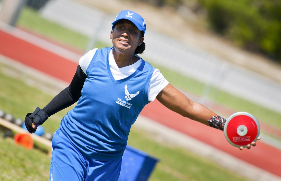 Julianna Walker, a Warrior Games athlete, releases a discus during a track and field session at the Air Force team’s training camp at Eglin Air Force Base, Fla., April 5, 2016. Air Force photo by Samuel King Jr.