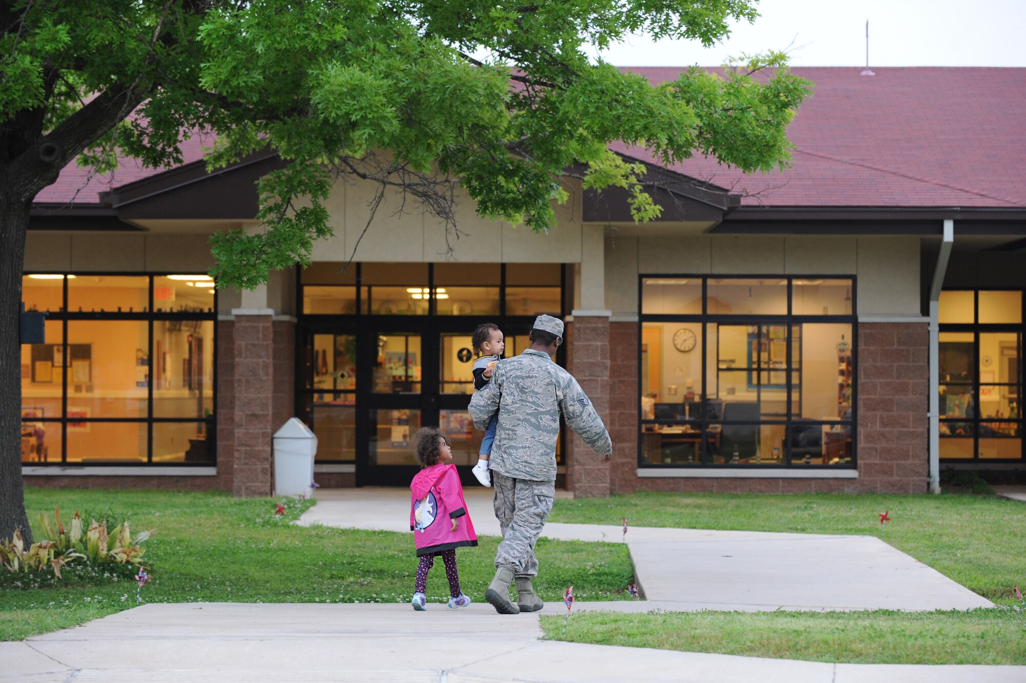 A parent drops their children off at the Child Development Center at Barksdale Air Force Base, La., April 15, 2016. The CDC holds the Give Parents a Break program once a month for parents who have an approved signed voucher from their First Sergeant,  medical personnel or Airman and Family Readiness personnel. (U.S. Air Force photo/Airman Alexis C. Frost)