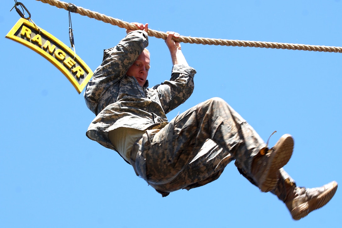 Army Staff Sgt. Erich Friedlein navigates a water confidence course during the 2016 Best Ranger Competition at Fort Benning, Ga., April 17, 2016. Friedlein, of the Pennsylvania National Guard, and Capt. Robert Killian, a Colorado National Guardsman, won the competition -- the first National Guard team to win in the event’s 33-year history. Army photo by Staff Sgt. Edward Reagan