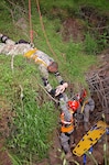 Soldiers with the Texas Natonal Guard's 836th Sapper Co., 6th CBRNE Enhanced Response Force Package – CERFP, part of the Joint Task Force 136th (Maneuver Enhancement Brigade), hand off an infant “casualty” during a low-angle rescue mission, as part of exercise Operation Vigilant Guard 2016 near Baton Rouge, Louisiana, April 15-17, 2016. 