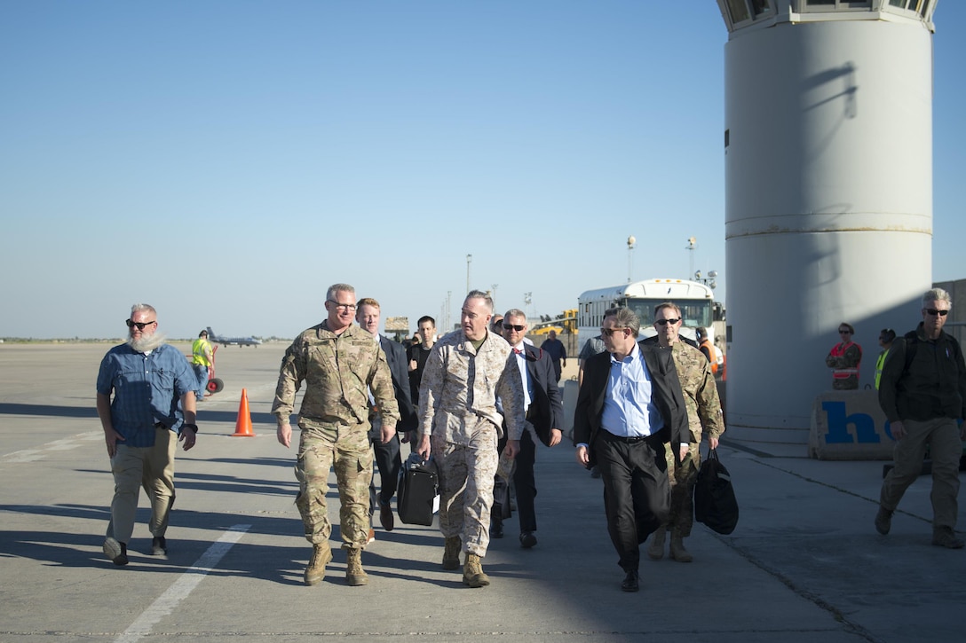 Marine Corps Gen. Joe Dunford, chairman of the Joint Chiefs of Staff, center, speaks to U.S. Ambassador to Iraq, Stuart E. Jones, right, and Army Gen. Paul J. LaCamera, chief, Office of Security Cooperation - Iraq, after arriving in Baghdad, April 20, 2016. DoD photo by Navy Petty Officer 2nd Class Dominique A. Pineiro