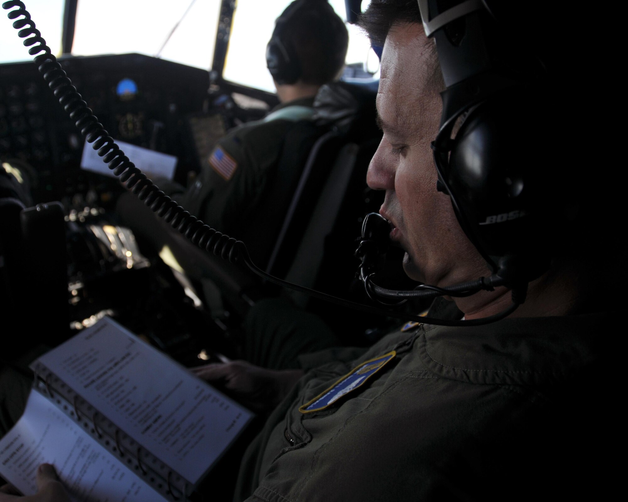 Master Sgt. Scott Randall, 700th Airlift Squadron flight engineer, reviews a checklist during the C-130’s flight from Aviano Air Base, Italy to Hohenfels Training Area, Germany on April 11, 2016. The 94th Airlift Wing participated in Exercise Saber Junction 16 April 11-15. (U.S. Air Force photo/ Senior Airman Andrew J. Park)

