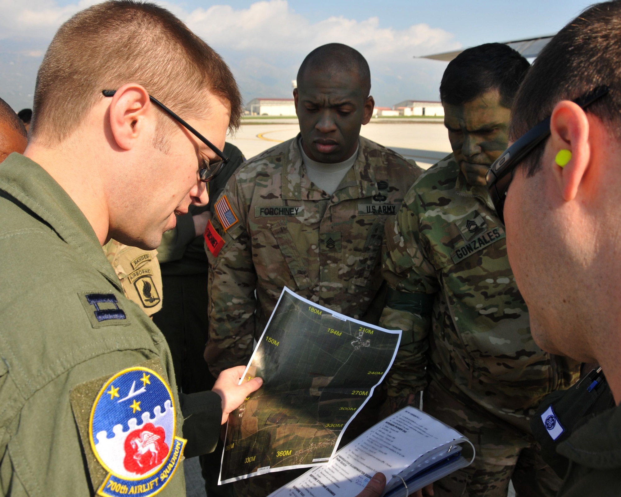 Capt. Christopher Retzlaff, 700th Airlift Squadron navigator, briefs the flight crew and Army jumpmasters at Aviano Air Base, Italy on April 12. The 94th Airlift Wing participated in Exercise Saber Junction 16 April 11-15 (U.S. Air Force photo/ Senior Airman Andrew J. Park)
