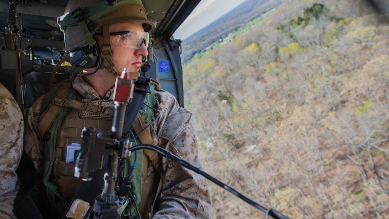 A student at the Marine Military Police Officers Basic Course looks for the landing zone during a field exercise at Fort Leonard Wood, Missouri, Apr. 14, 2016. The exercise tests officers on skills they learned throughout their 70 days of training. (Official Marine Corps photo by Lance Cpl. Julien Rodarte/Released)