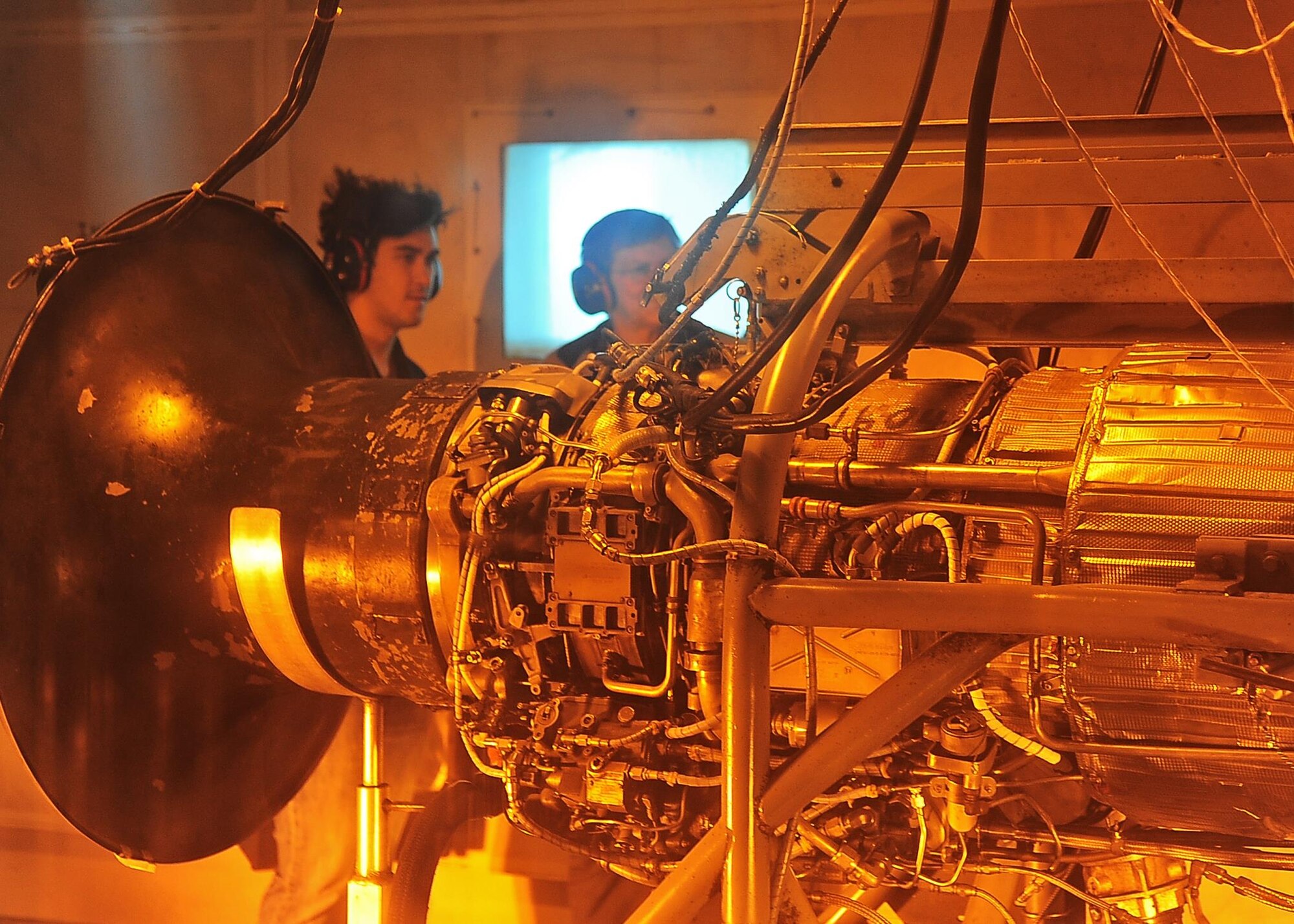Steve Wallis, Engine Mechanic with L-3 Communications, shows off the power of a T-38C Talon engine to Joseph Alelthawe, Mississippi State University senior, during a tour of the engine testing facility April 12 on Columbus Air Force Base, Mississippi. The Aerospace Engineering class toured the BLAZE hangar, propulsions lab, and the T-38C Talon test cell. (U.S. Air Force photo/Senior Airman Stephanie Englar)