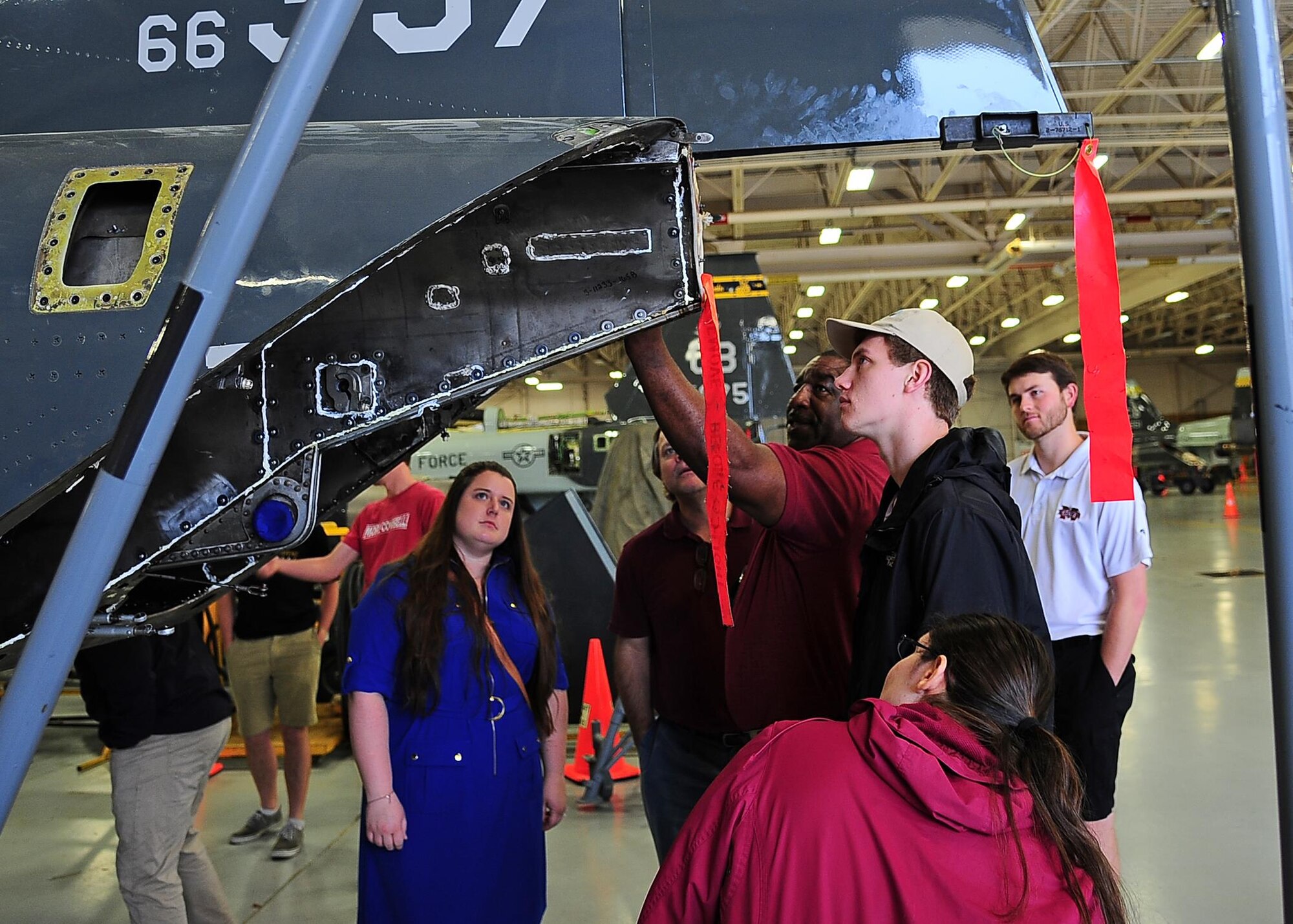 Randy Mastin, 14th Flying Training Wing Aircraft Maintenance T-38C Talon Foreman, points out various features on the T-38C Talon to the Mississippi State University Aerospace Engineering class during a tour April 12 on Columbus Air Force Base, Mississippi. This hands-on part of the tour allowed the students to get a closer look at the United States Air Force trainer aircraft. (U.S. Air Force photo/Senior Airman Stephanie Englar)