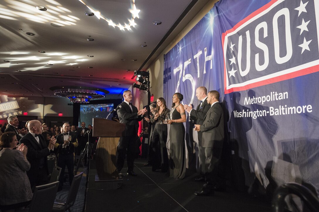 Wrestler John Cena joins the audience in applauding service members during the USO of Metropolitan Washington-Baltimore’s annual awards dinner in Arlington, Va., April 19, 2016. DoD photo by Army Staff Sgt. Sean K. Harp