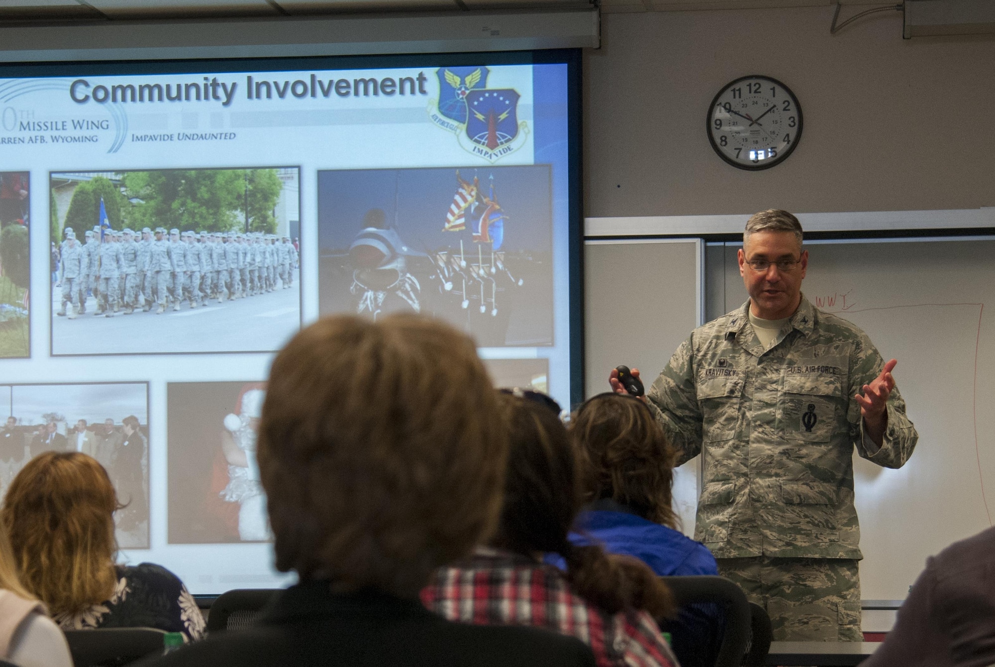 Col. Strephen Kravitsky, 90th Missile Wing commander, briefs a tour group composed of local educators from Cheyenne, Wyo., April 19, 2016, in the Airman and Family Readiness Center on F.E. Warren Air Force Base, Wyo. The briefing detailed the mission of the wing and its constituent units, and he discussed the partnerships between the base and local community. (U.S. Air Force photo by Senior Airman Jason Wiese)