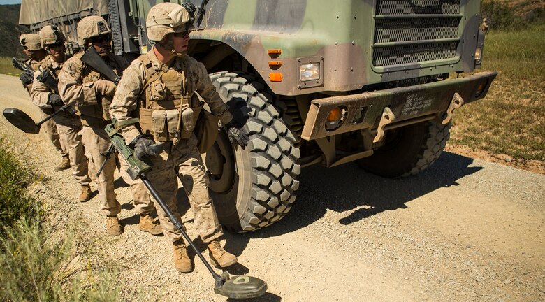 MARINE CORPS BASE CAMP PENDLETON, Calif. – Marines from 7th Engineer Support Battalion conduct a reaction to a simulated improvised explosive device by sweeping in front of the downed vehicle at Camp Pendleton March 25, 2016. Marines performed the training in preparation for upcoming deployments with the Special Purpose Marine Air-Ground Task Force Crisis Response Central Command, Marine Rotational Force-Darwin and Koa Moana. (U.S. Marine Corps photo by Lance Cpl. Justin E. Bowles/ Released)