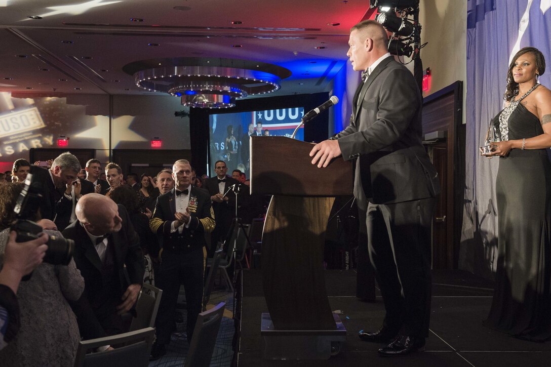 Professional wrestler John Cena speaks during the USO of Metropolitan Washington-Baltimore annual awards dinner after receiving the Legacy of Achievement Award in Arlington, Va., April 19, 2016. The award recognizes civilians who demonstrate a deep commitment to the nation's military and have contributed to educating others about the service and sacrifice of U.S. troops. DoD photo by Army Staff Sgt. Sean K. Harp