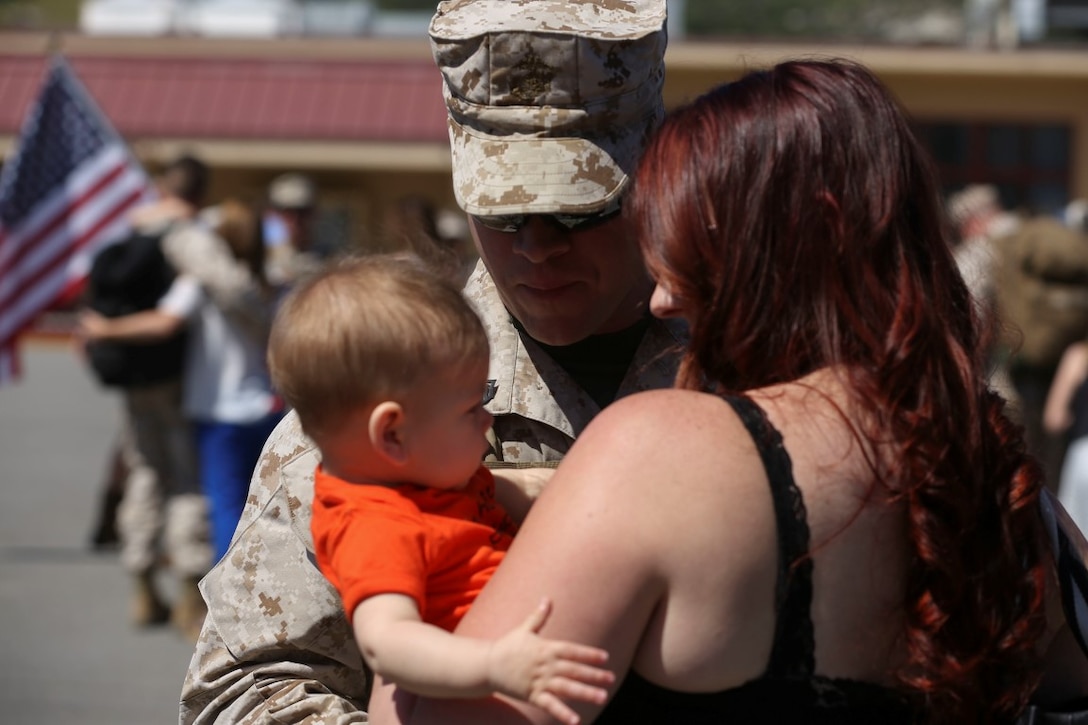 MARINE CORPS BASE CAMP PENDLETON, Calif. – Staff Sgt. Christopher Lewis, the civil-military operations chief with Special Purpose Marine Air-Ground Task Force - Crisis Response - Central Command 16.1, from Wilmington, Ohio, is reunited with his family at a homecoming celebration on Camp Pendleton April 17, 2016. SPMAGTF-CR-CC is a rotational contingent of approximately 2,300 Marines and sailors sourced from units throughout I Marine Expeditionary Force. Aside from operations directly supporting Operation Inherent Resolve, the task force worked with the Jordanian Armed Forces to develop and professionalize a first-of-its-kind quick reaction force. (U.S. Marine Corps photo by Cpl. Angel Serna/Released)