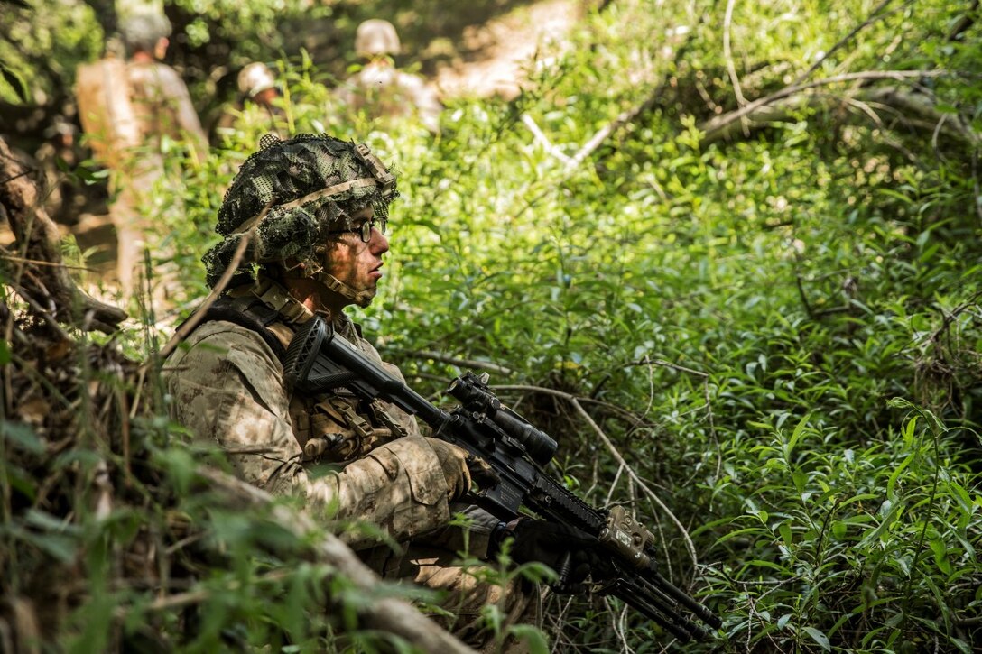 MARINE CORPS BASE CAMP PENDLETON, Calif. – Lance Cpl. Wesley Craddock, automatic rifleman, Company K, 3rd Battalion, 1st Marine Regiment, 1st Marine Division, posts security during squad tactics training at Camp Pendleton April 19, 2016. Having recently returned from a deployment with 3rd Bn., 1st Marines, Craddock said he is eager to share lessons learned with new joins to his squad. Craddock is 22 years old and is from Detroit. (U.S. Marine Corps photo by Sgt. Emmanuel Ramos/Released)