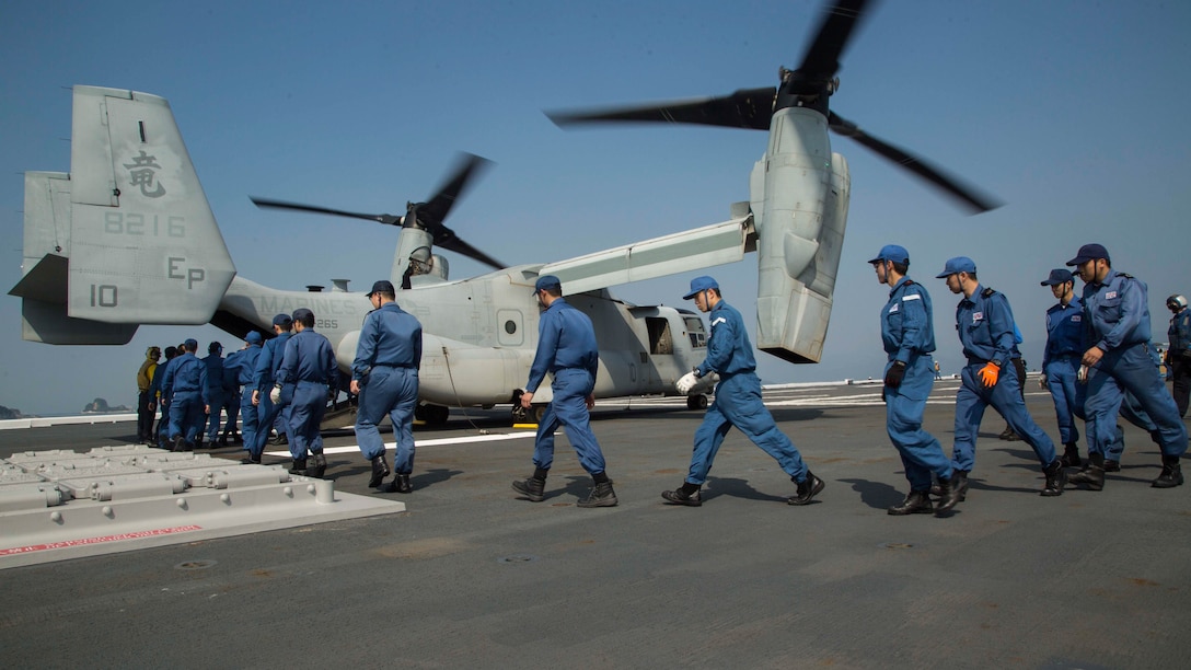 U.S. Marines assigned to Marine Medium Tiltrotor Squadron 265 (Reinforced), 31st Marine Expeditionary Unit and Japan Self-Defense Force members transport supplies onto an MV-22B Osprey aboard the JS Hyuga (DDH 181), April 19, 2016. The supplies are in support of the relief effort after a series of earthquakes struck the island of Kyushu. The 31st MEU is the only continually forward-deployed MEU and remains the Marine Corps' force-in-readiness in the Asia-Pacific region.