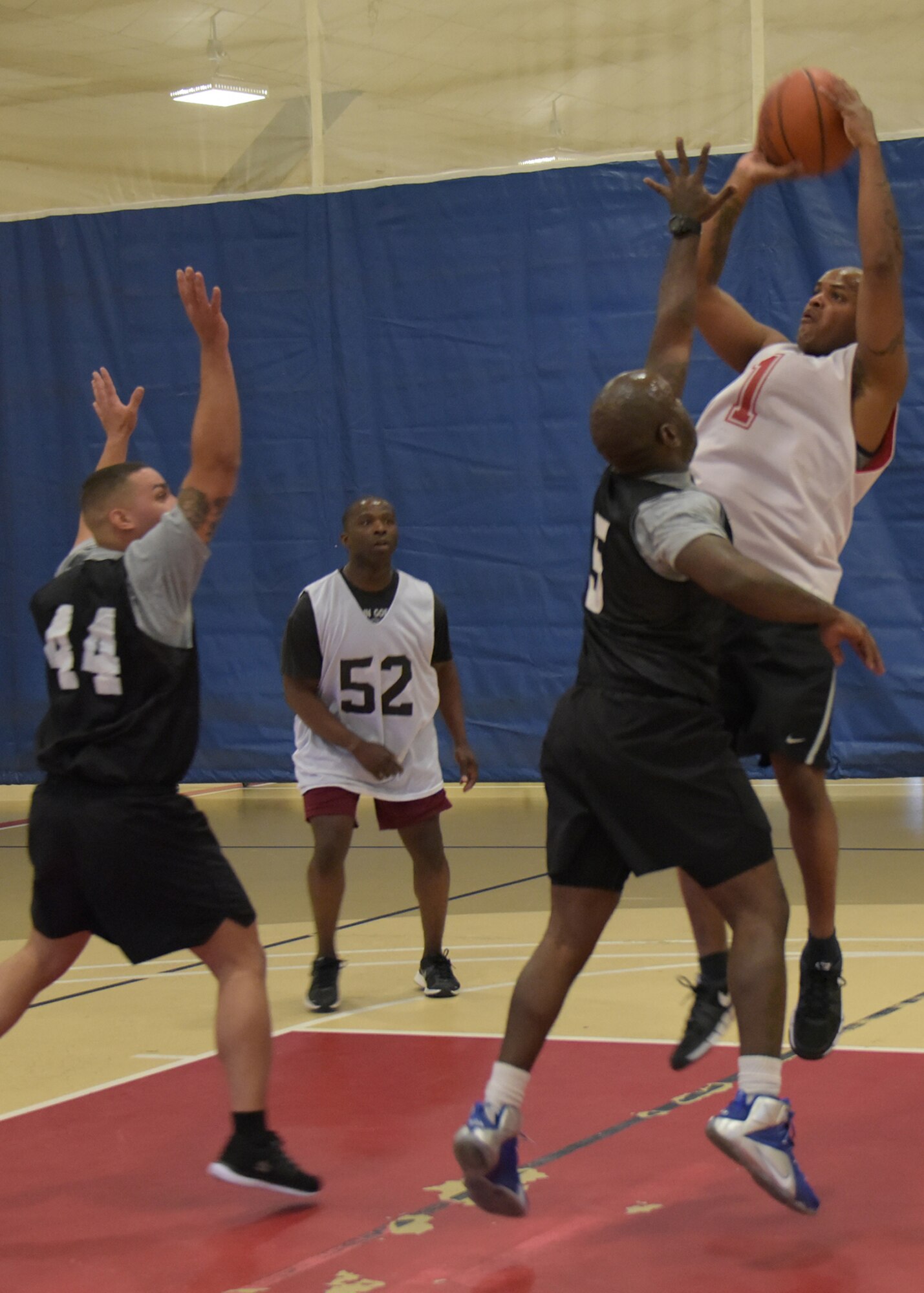 Service members representing the Army, Air Force and Navy from Joint Base McGuire-Dix-Lakehurst participate in a 3-on-3 basketball tournament in support of Sexual Assault Awareness Prevention Month here at the Griffith Field House April 18. (U.S. Air Force photo by Pascual Flores)