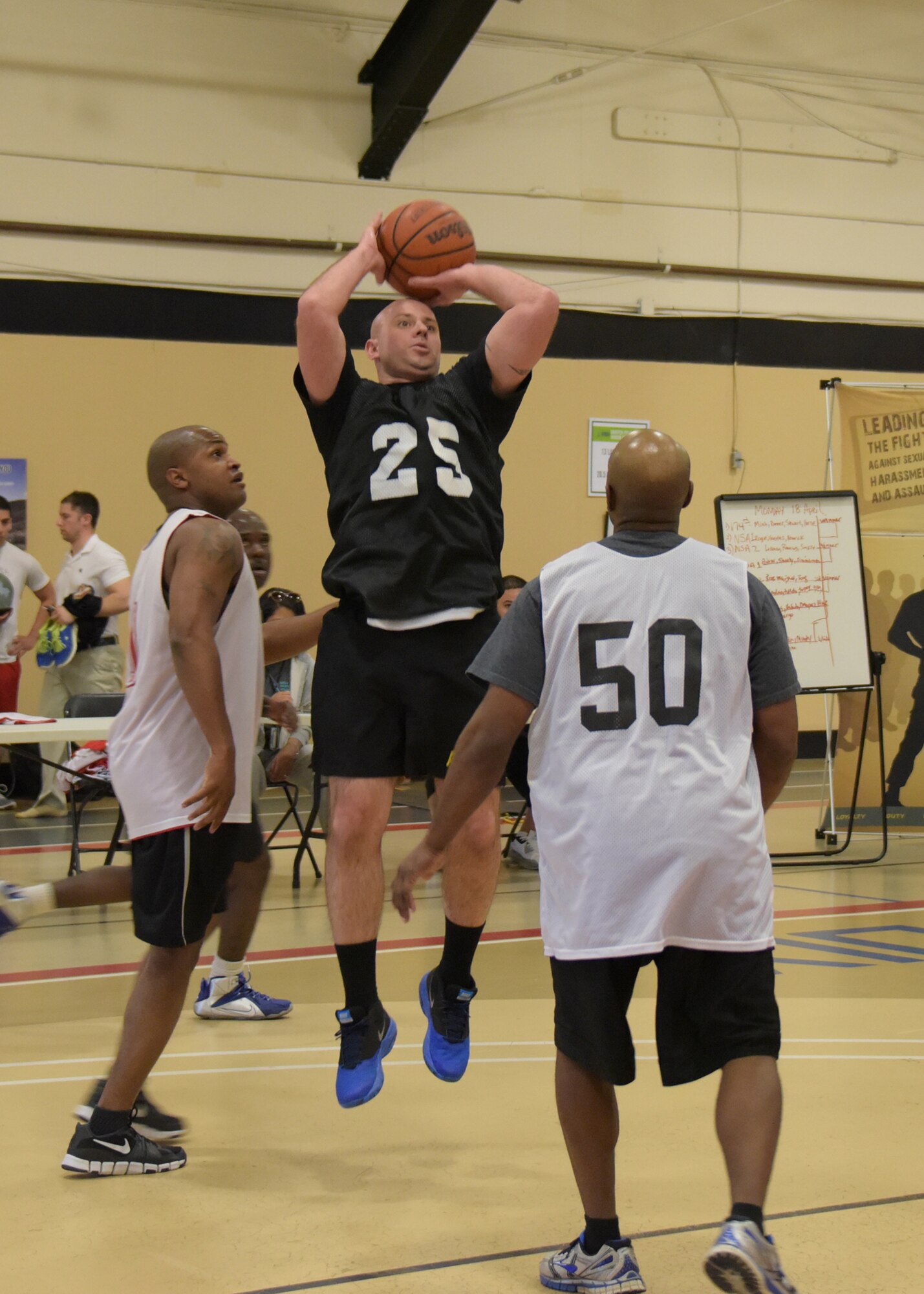 Service members representing the Army, Air Force and Navy from Joint Base McGuire-Dix-Lakehurst participate in a 3-on-3 basketball tournament in support of Sexual Assault Awareness Prevention Month here at the Griffith Field House April 18. (U.S. Air Force photo by Pascual Flores)