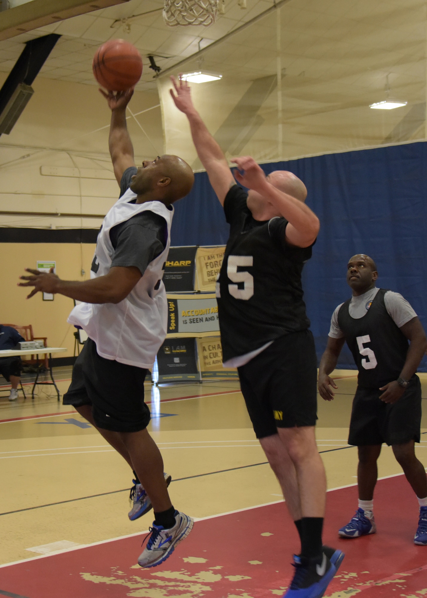 Service members representing the Army, Air Force and Navy from Joint Base McGuire-Dix-Lakehurst participate in a 3-on-3 basketball tournament in support of Sexual Assault Awareness Prevention Month here at the Griffith Field House April 18. (U.S. Air Force photo by Pascual Flores)