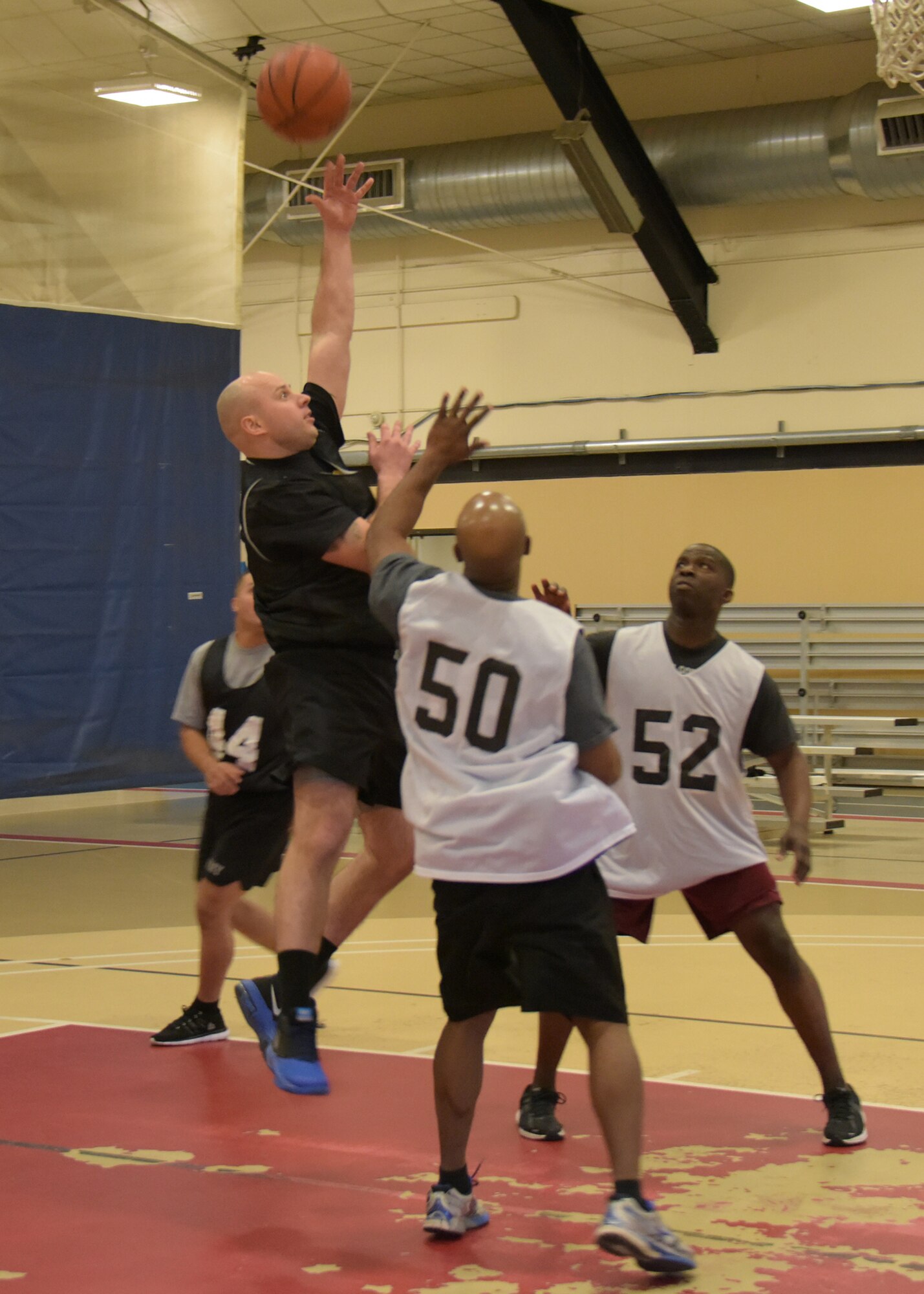 Service members representing the Army, Air Force and Navy from Joint Base McGuire-Dix-Lakehurst participate in a 3-on-3 basketball tournament in support of Sexual Assault Awareness Prevention Month here at the Griffith Field House April 18. (U.S. Air Force photo by Pascual Flores)