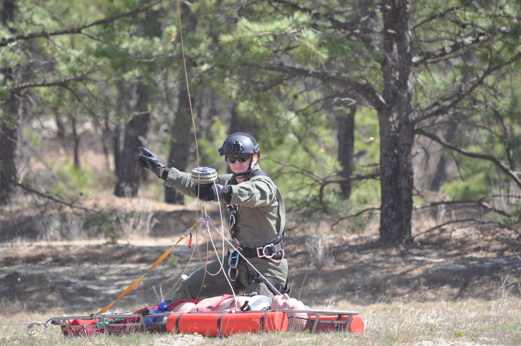 The New Jersey Army National Guard aviation team tested their ability to move people and equipment to where they are needed in a natural disaster on April 16-17, 2016 at Joint Base-McGuire-Dix-Lakehurst, N.J. The 150th Assault Helicopter Battalion used a pair of UH-60 Black Hawk helicopters to airlift 40 members of the New Jersey Task Force 1 urban search and rescue unit from their headquarters on Lakehurst to the range area of JB MDL. Along for the ride were several live-find canines joining the task force volunteers. During the exercise, the aviators sling loaded a box of search and rescue equipment for the New Jersey State Troopers assigned to the Office of Emergency Management. A UH-72 Lakota helicopter from the 1-224th Security and Support Battalion flew overhead to provide aerial reconnaissance for the search and rescue exercise. The weekend event is the first for Operation Derecho as several training exercises are planned for the year.
(Photos by 1st Sgt. Kryn Westhoven and Sgt. Jorge Morales)
