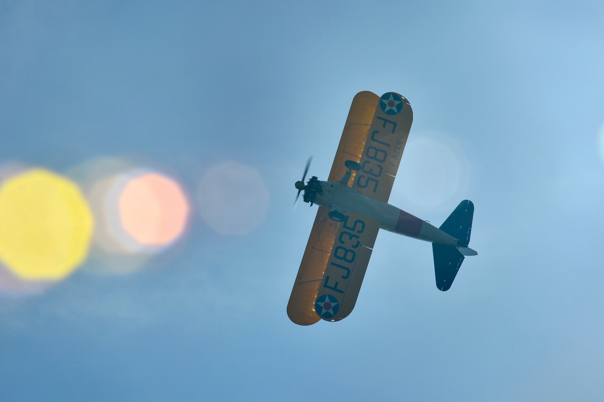 PARIS – A World War I-era Stearman PT-17 biplane flies over the Lafayette Escadrille Memorial in Marnes-la-Coquette, France, April 20, 2016, during a ceremony honoring the 268 Americans who joined the French Air Force before the U.S. officially engaged in World War I. In addition to the Stearman, four U.S. Air Force fifth generation F-22 Raptor fighters, a B-52 Stratofortress bomber, three FAF Mirage 2000Ns and one FAF Rafale performed flyovers during the ceremony commemorating the 100th anniversary of the Layfette Escadrille’s formation. Men of the Lafayette Escadrille and Lafayette Flying Crops were critical to the formation of the USAF. (U.S. Air Force Photo by Tech. Sgt. Joshua DeMotts/Released)