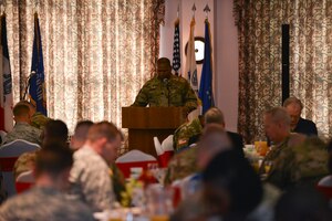 U.S. Army Chaplain (Lt. Col.) Juan Crockett, command chaplain for Center for Initial Military Training, leads prayer for national leaders during the National Prayer Breakfast at Fort Eustis, Va., April 15, 2016. During the event, U.S. Army and Air Force members joined one another in giving thanks and praise to those who fought and continue to fight for the nation and its allies. (U.S. Air Force photo by Staff Sgt. Natasha Stannard)