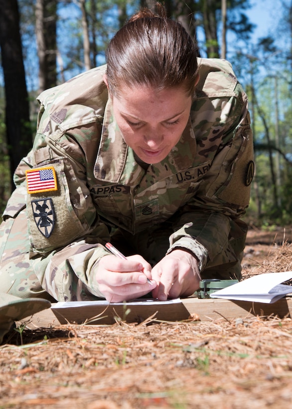 U.S. Army Staff Sgt. Melissa Zappas, a platoon sergeant cargo specialist assigned to the 688th Rapid Port Opening Element, plots points for land navigation during the 597th Transportation Brigade Best Warrior Competition at Fort Eustis, Va., April 15, 2016. The Soldiers’ performed land navigation during the day and night in the woods. (U.S. Air Force photo by Staff Sgt. J.D. Strong II)