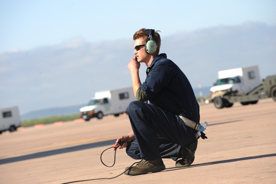 U.S. Air Force Staff Sgt. Robert Gallagher, 7th Aircraft Maintenance Squadron crew chief, prepares to marshal a B-1B Lancer during Exercise Constant Vigilance 16, April 10, 2016, at Dyess Air Force Base, Texas. Constant Vigilance 16 is one of many training operations conducted by Air Force Global Strike Command to ensure Airmen are ready to perform nuclear deterrence operations and long-range strike missions. (U.S. Air Force photo by Airman 1st Class Rebecca Van Syoc/Released)