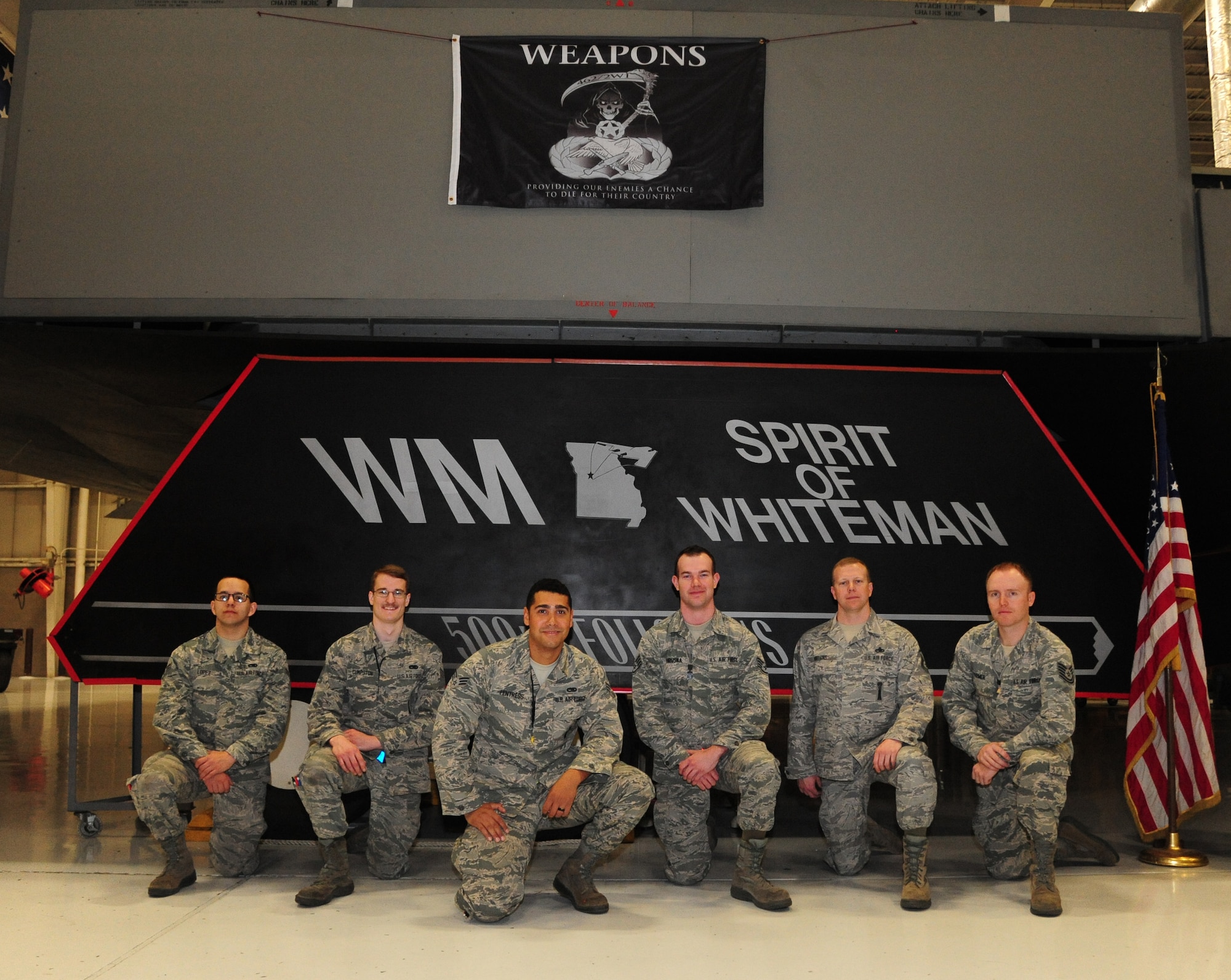 Aircraft armament systems technicians from the 509th and 131st Aircraft Maintenance Squadron pose for a group photo at Whiteman Air Force Base, Mo., April 14, 2016. During exercise CONSTANT VIGILANCE 16 (CV16), drill-status guardsmen (DSG) had the opportunity to work alongside their full-time counterparts, which marked the first time DSG have participated in the actual loading of weapons during an exercise. (U.S. Air Force photo by Airman 1st Class Keenan Berry)