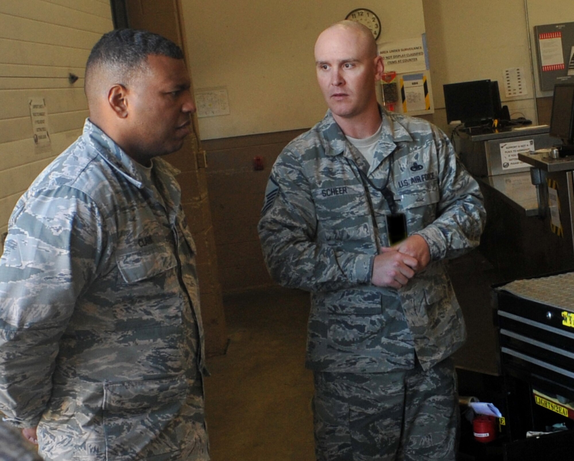 Maj. Gen. Richard M. Clark, 8th Air Force commander, speaks with Master Sgt. Landon Scheer, the sortie support superintendent from the 509th Aircraft Maintenance Squadron, at Whiteman Air Force Base, Mo., April 12, 2016. Clark learned first-hand how Airmen maintain the B-2 Spirit during the CONSTANT VIGILANCE 16 exercise, an annual Air Force Global Strike Command directed event designed to test the wing’s ability to support their conventional and nuclear missions. (U.S. Air Force photo illustration by Airman 1st Class Michaela Slanchik)