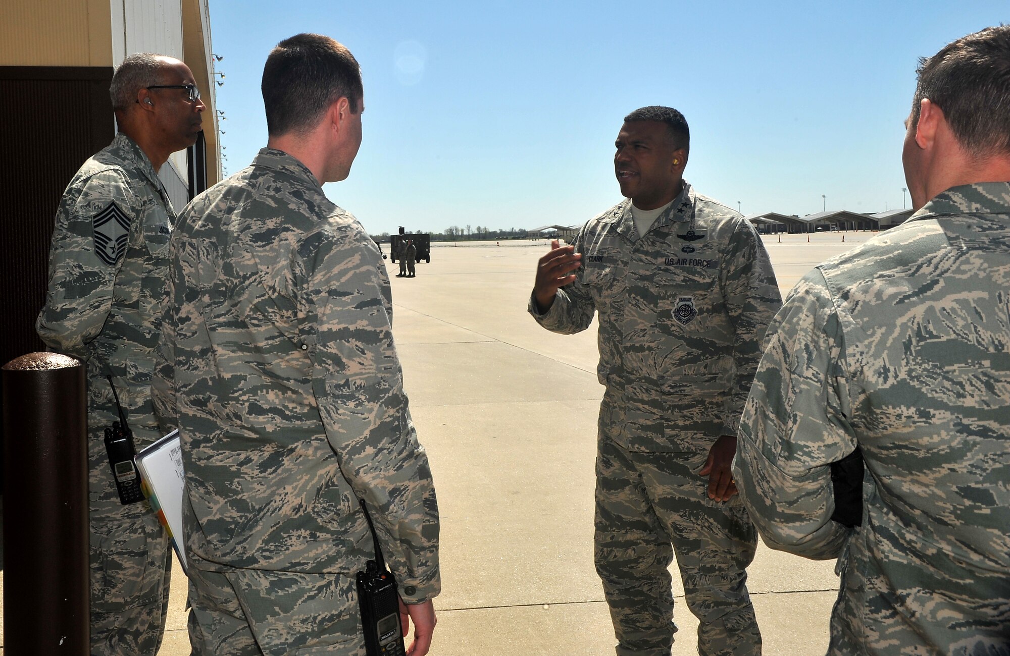 Maj. Gen. Richard M. Clark, 8th Air Force commander, center, speaks with members of the 509th Bomb Wing outside an aircraft hangar at Whiteman Air Force Base, Mo., April 12, 2016. Clark visited Whiteman to observe operations during the CONSTANT VIGILANCE 16 exercise. (U.S. Air Force photo by Airman 1st Class Michaela Slanchik)