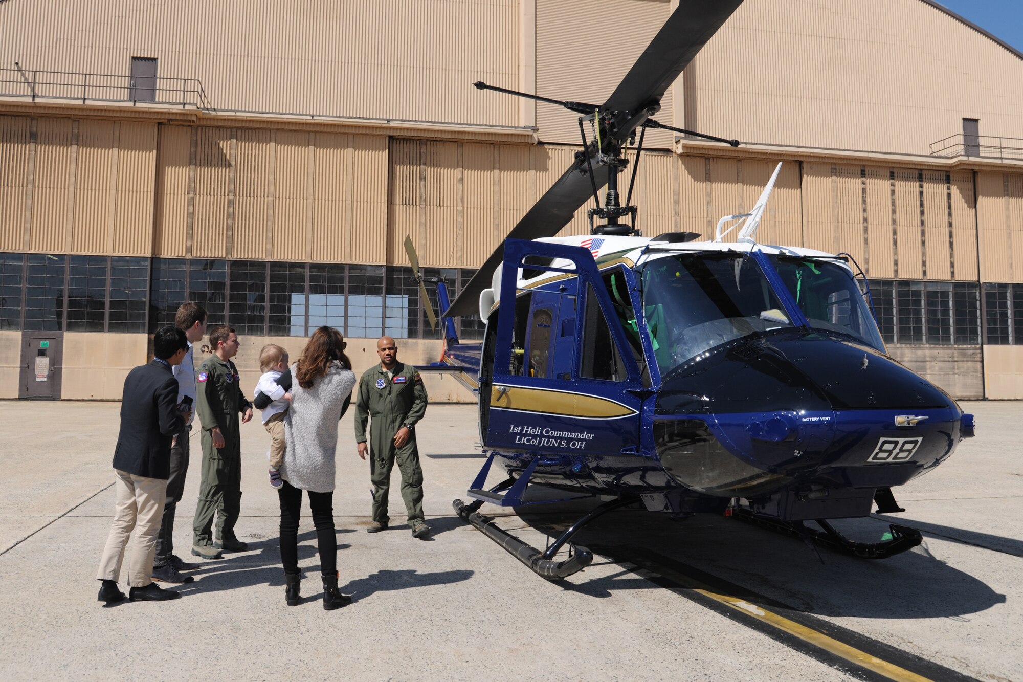 Airmen from the 1st Helicopter Squadron give a tour to the Andrews family at Joint Base Andrews, Md., April 14, 2016. The Andrews family, visited JBA to learn about the history of the base and of their great-great uncle, deceased Lt. Gen. Frank M. Andrews, of whom the base is named after. (U.S. Air Force photo by Airman Gabrielle Spalding/Released)