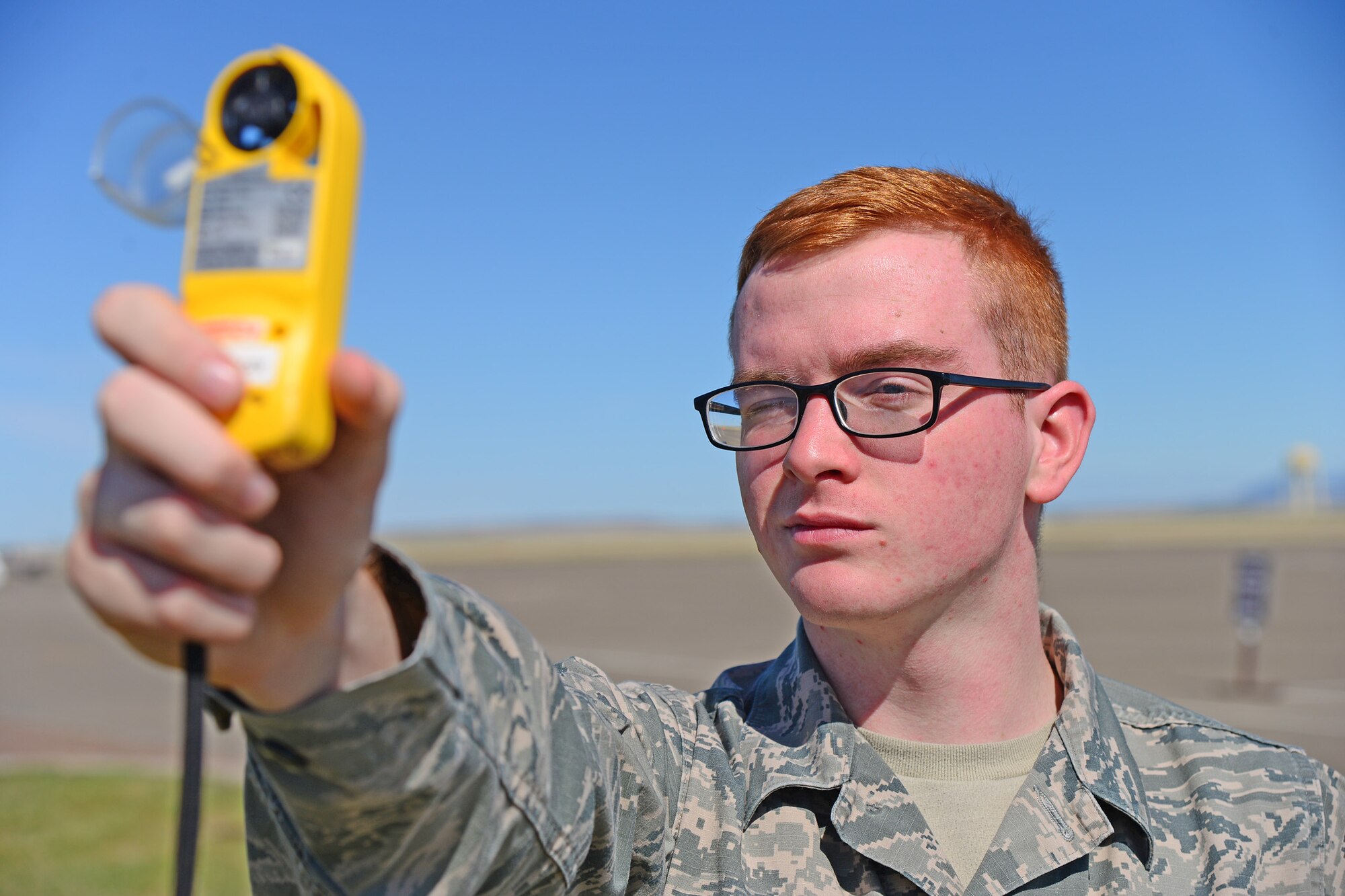 Airman 1st Class David Alley, 341st Operations Support Squadron weather forecaster, uses a weather and wind meter April 19, 2016, at Malmstrom Air Force Base, Mont. The meter is used to measure wind direction and speed, altimeter setting, station pressure, dew point and temperature. (U.S. Air Force photo/Airman Daniel Brosam)