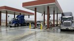 Fuel trucks offload fuel at the new Bulk Fuels Storage Area recently. The new BFSA can offload 2 trucks at a time in 30 minutes, compared to the old facility which could only handle one truck per hour. (U.S. Air Force photo.)