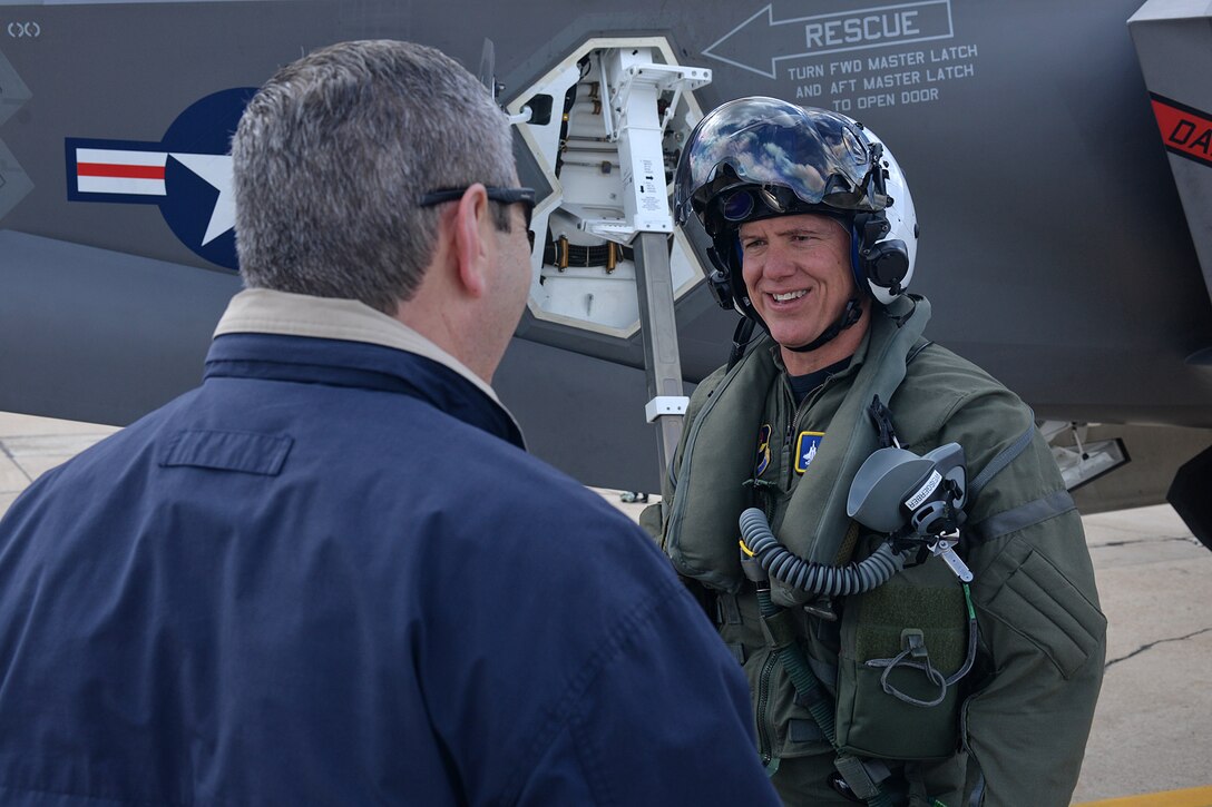 U.S. Navy Capt. Mark Weisgerber, 33rd Fighter Wing vice commander, Eglin Air Force Base, Florida, is greeted by Greg Hoffman, 570th Aircraft Maintenance Squadron director, at Hill AFB, Utah, April 15.  Weisgerber flew an F-35C Lightning II aircraft to the base where it will be modified at the Ogden Air Logistics Complex. The Ogden ALC is the first to work on the entire fleet of F-35 variants, which also includes the Air Force’s F-35A model and the Marine Corps’ F-35B model. (U.S. Air Force photo by Alex R. Lloyd)