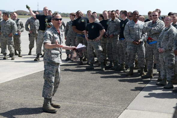 Col. Steven James, 374th Maintenance Group commander, speaks with maintenance Airmen during a 374 MXG Rodeo Competition at Yokota Air Base, Japan, April 15, 2016. The 374th Maintenance Squadron, 374th Aircraft Maintenance Squadron and 374th Maintenance Operations Flight were the three teams competing in the rodeo. (U.S. Air Force photo by Staff Sgt. Cody H. Ramirez/Released)