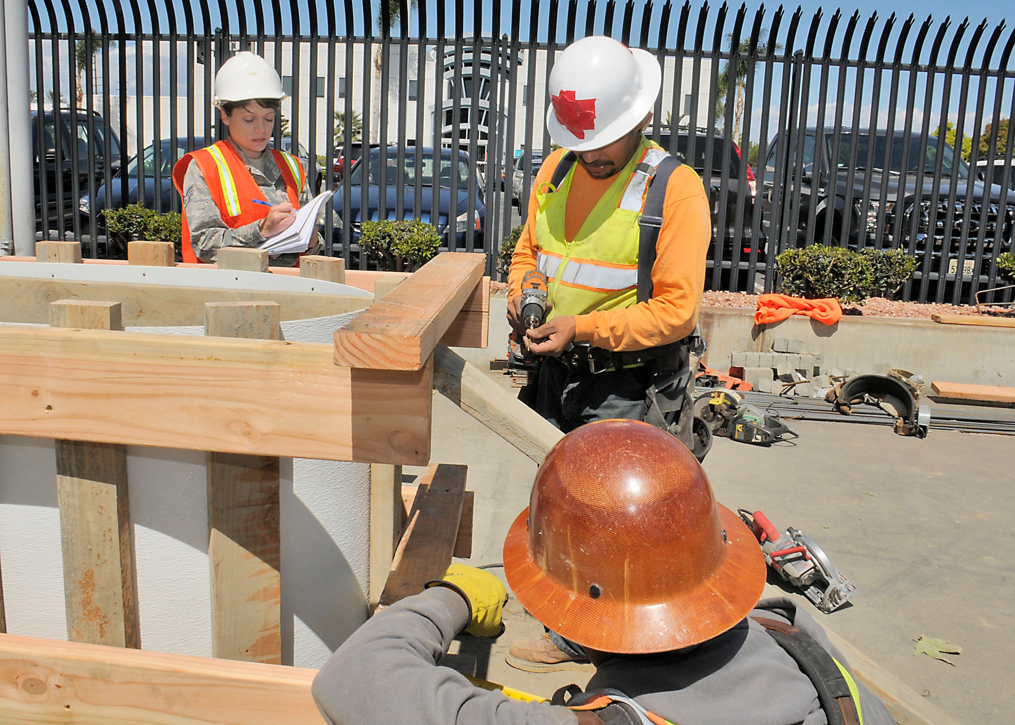 Senior Airman Gladys Pargas, contract specialist for SMC/PK is making sure that front gate renovation is completed on time.  (U.S Air Force photo/Joe Juarez)
