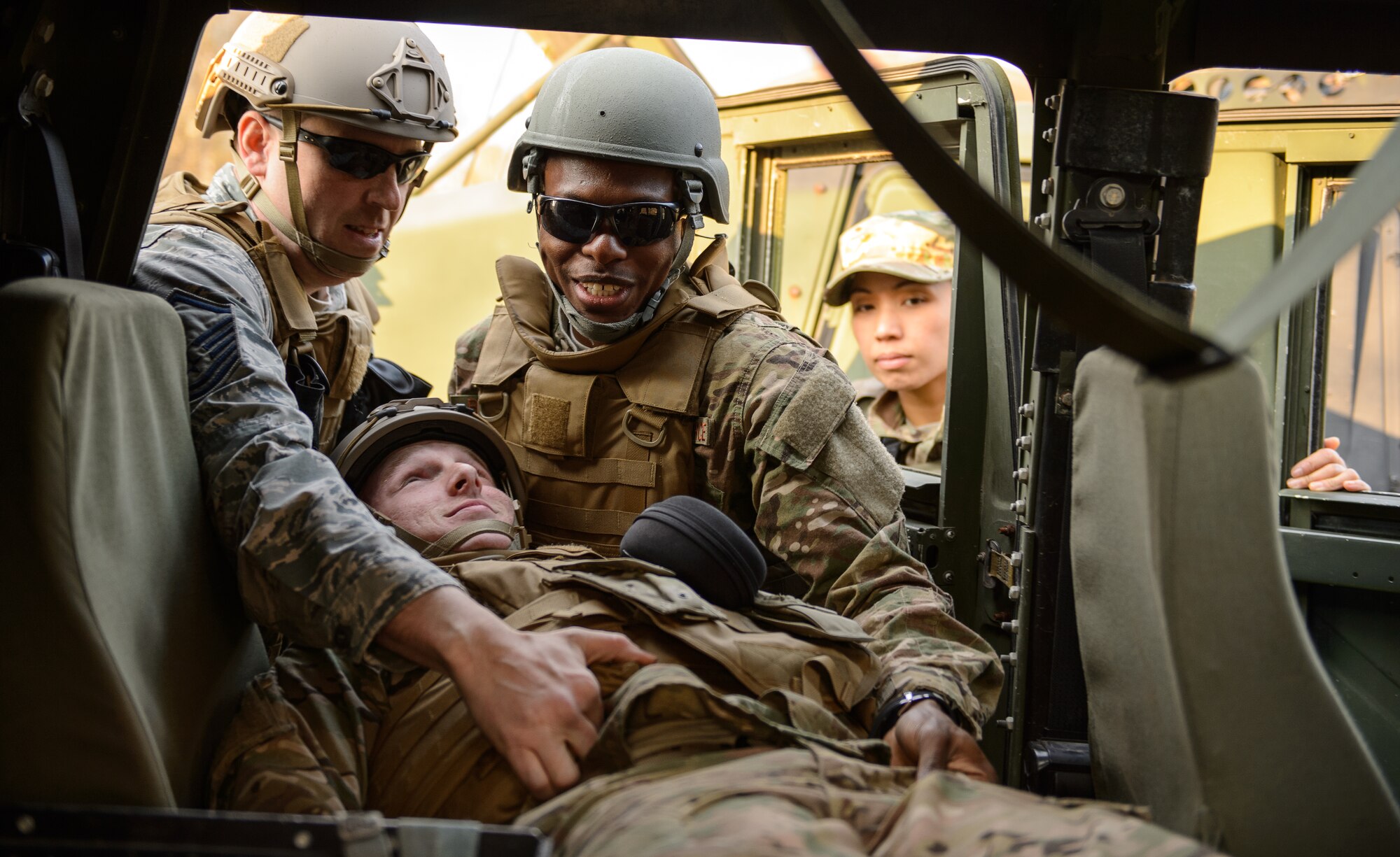 Airmen from the 435th Air Ground Operations Wing practice recovering an “injured” teammate at Ramstein Air Base, Germany April 11, 2016. 435th Security Forces Squadron instructors guided the Airmen in best practices to ensure the safety and security of the deploying Airmen. (U.S. Air Force photo/Staff Sgt. Armando A. Schwier-Morales)