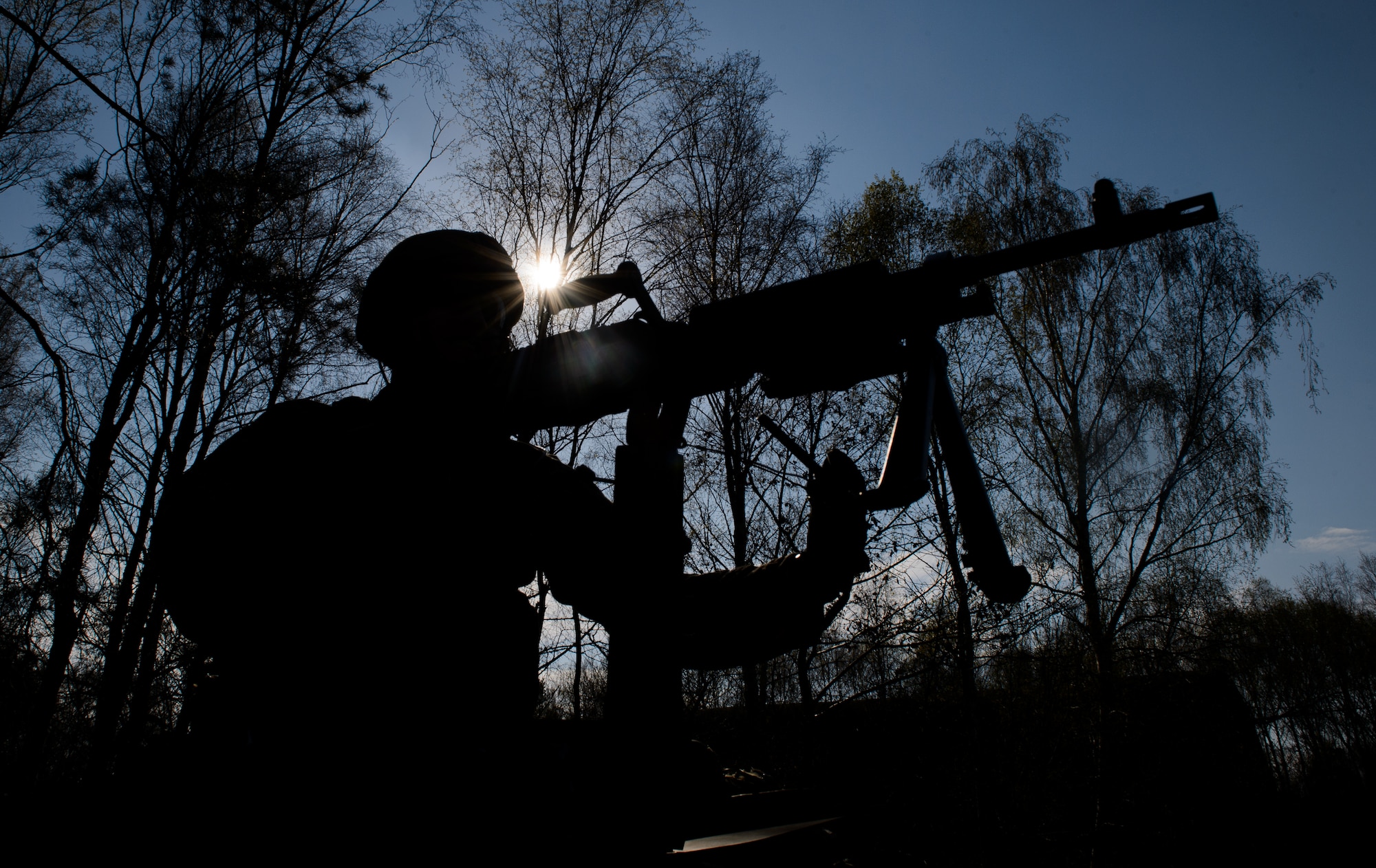 An instructor from the 435th Security Forces Squadron removes a weapon from a Humvee at Ramstein Air Base, Germany, April 11, 2016. The Airmen practiced for scenarios they might encounter during deployment. (U.S. Air Force photo/Staff Sgt. Armando A. Schwier-Morales)