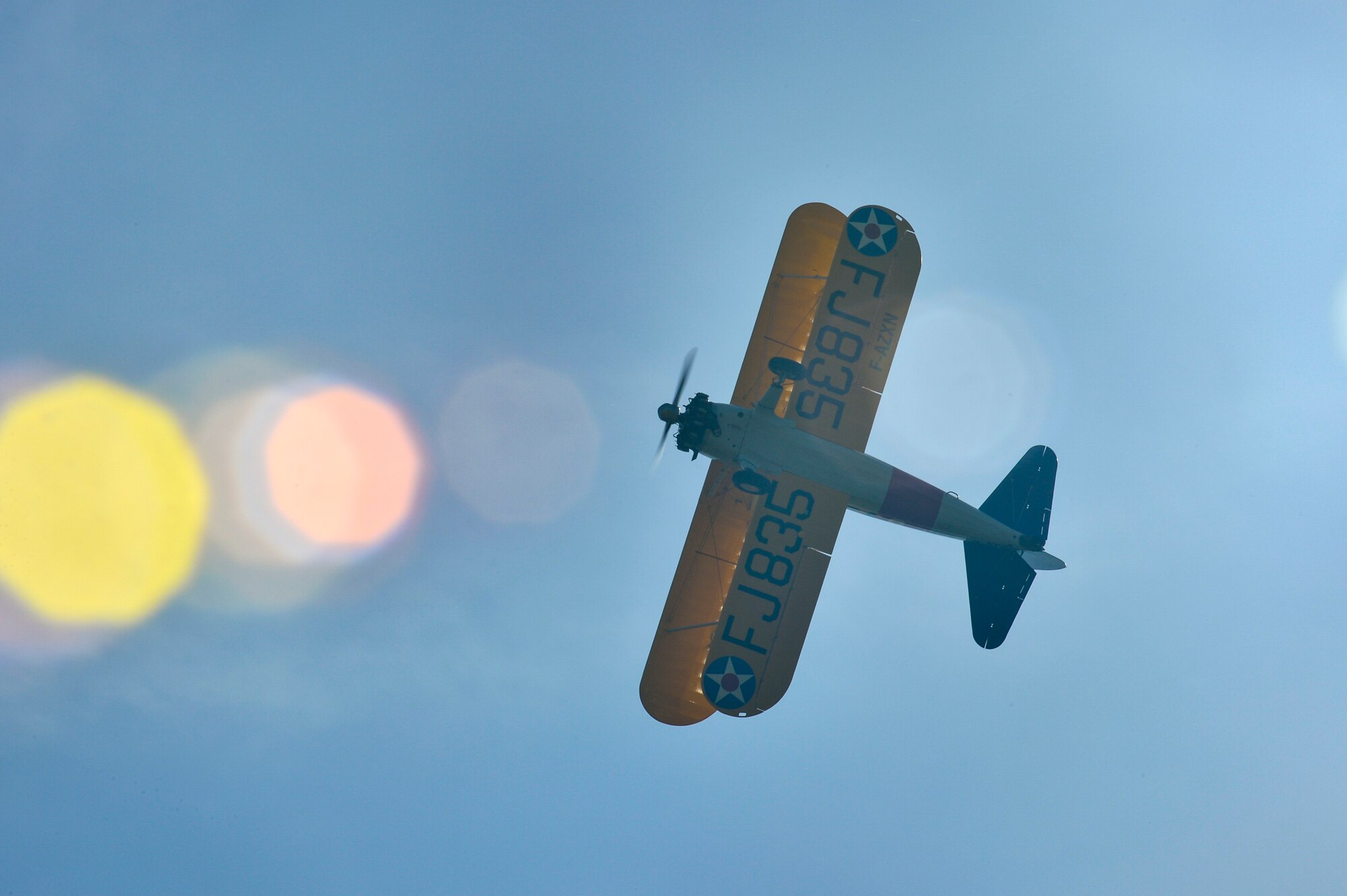PARIS – A World War I-era Stearman PT-17 biplane flies over the Lafayette Escadrille Memorial in Marnes-la-Coquette, France, April 20, 2016, during a ceremony honoring the 268 Americans who joined the French Air Force before the U.S. officially engaged in World War I. In addition to the Stearman, four U.S. Air Force fifth generation F-22 Raptor fighters, a B-52 Stratofortress bomber, three FAF Mirage 2000Ns and one FAF Rafale performed flyovers during the ceremony commemorating the 100th anniversary of the Layfette Escadrille’s formation. Men of the Lafayette Escadrille and Lafayette Flying Crops were critical to the formation of the USAF. (U.S. Air Force Photo by Tech. Sgt. Joshua DeMotts/Released)