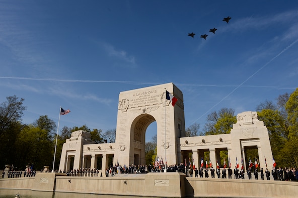 PARIS – Four U.S. Air Force F-22 Raptor fifth generation fighters fly over the Lafayette Escadrille Memorial in Marnes-la-Coquette, France, April 20, 2016, during a ceremony honoring the 268 Americans who joined the French Air Force before the U.S. officially engaged in World War I. In addition to the F-22s, a USAF B-52 Stratofortress bomber, three FAF Mirage 2000Ns, one FAF Rafale and a World War I-era Stearman PT-17 biplane performed flyovers during the ceremony commemorating the 100th anniversary of the Layfette Escadrille’s formation. Men of the Lafayette Escadrille and Lafayette Flying Crops were critical to the formation of the U.S. Air Force. (U.S. Air Force Photo by Tech. Sgt. Joshua DeMotts/Released)