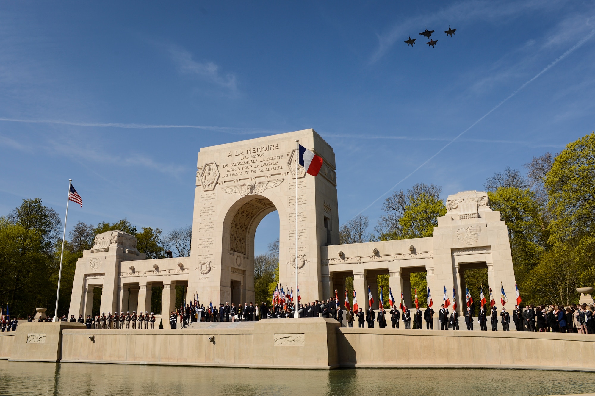 PARIS – Three French Air Force Mirage 2000Ns and one FAF Rafale fly over the Lafayette Escadrille Memorial in Marnes-la-Coquette, France, April 20, 2016, during a ceremony honoring the 268 Americans who joined the FAF during WWI. In addition to the Mirages and Rafale, four U.S. Air Force F-22 Raptor fifth generation fighters, a USAF B-52 Stratofortress bomber, and a World War I-era Stearman PT-17 biplane performed flyovers during the ceremony commemorating the 100th anniversary of the Layfette Escadrille’s formation. Men of the Lafayette Escadrille and Lafayette Flying Crops were critical to the formation of the U.S. Air Force. (U.S. Air Force Photo by Tech. Sgt. Joshua DeMotts/Released)