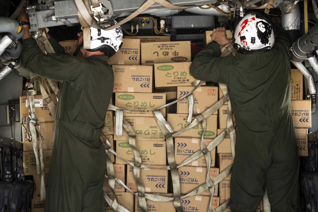 Marines secure relief supplies aboard an MV-22B Osprey aircraft on Marine Corps Air Station Iwakuni, Japan April 20, 2016. The Marines are assigned to Marine Medium Tiltrotor Squadron 265, Reinforced, 31st Marine Expeditionary Unit. The supplies will be delivered to Haksui Sports Park in Minamiaso, where Japanese Self Defense Force members will distribute them to those most affected by the earthquakes. Marine Corps photo by Sgt. Royce Dorman
