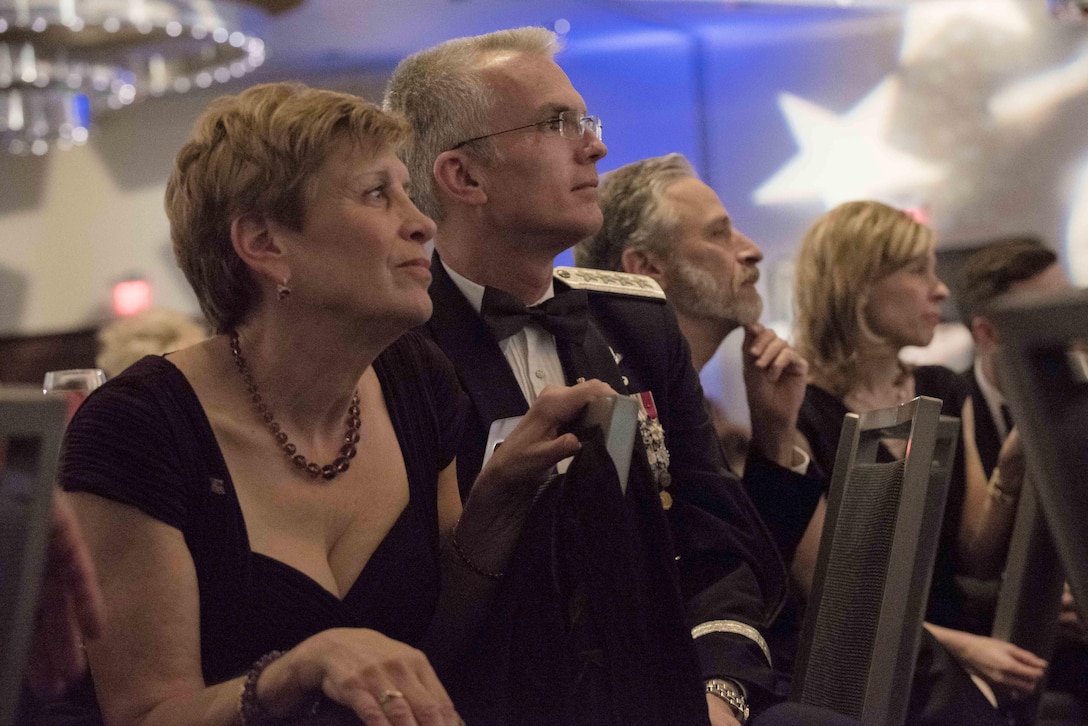 Ellyn Dunford, wife of Marine Gen. Joseph Dunford, chairman of the Joint Chiefs of Staff, Air Force Gen. Paul J. Selva, vice chairman of the Joint Chiefs of Staff, and former Daily Show host Jon Stewart listen from the audience during the USO Metropolitan Washington-Baltimore annual awards dinner, in Arlington, Va., April 19, 2016.  During the event, which highlighted their 75th anniversary, the USO honored the service and sacrifice of the U.S. Armed Forces and featured a tribute to special operations forces.  DoD photo by Army Staff Sgt. Sean K. Harp