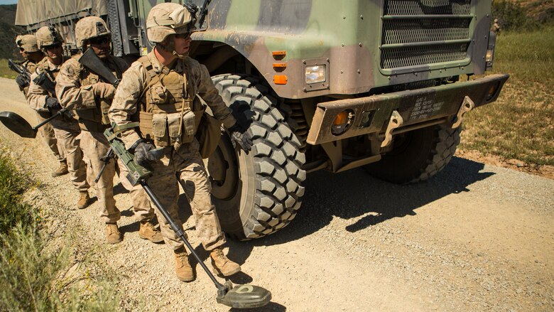 Marines from 7th Engineer Support Battalion conduct a reaction to a simulated improvised explosive device by sweeping in front of the downed vehicle at Marine Corps Base Camp Pendleton March 25, 2016. Marines performed the training in preparation for upcoming deployments with the Special Purpose Marine Air-Ground Task Force Crisis Response Central Command, Marine Rotational Force-Darwin and Koa Moana.